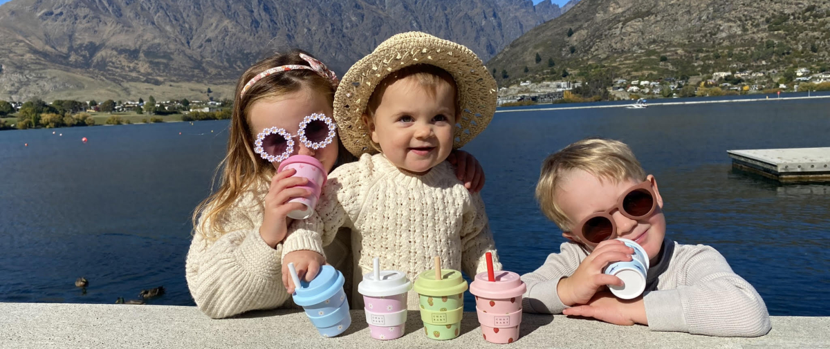 Family of colourful children in front of Lake Whakatipu at Queenstown